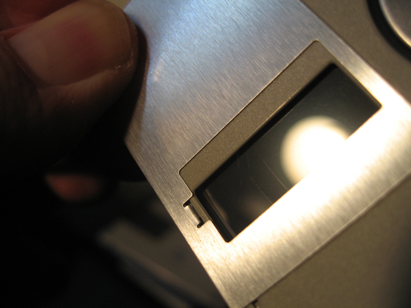 Grooves carved into a 3.5 inch floppy disk